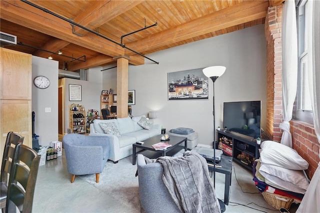 712 Broadway Blvd Unit 607, Kansas City, MO 64105 - living room featuring finished concrete floors and wooden ceiling with exposed beams