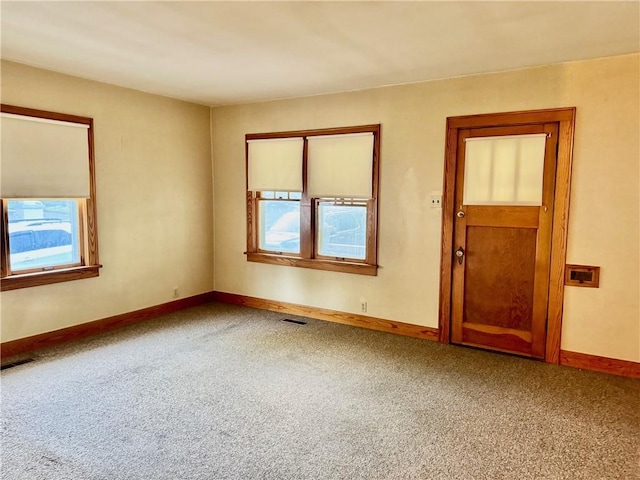 211 Park Ave, Parsons, KS 67357 - empty room with carpet flooring and baseboards