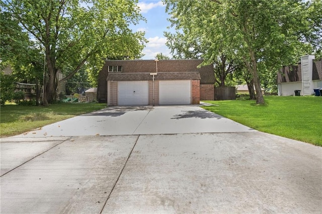 3729 Brush Creek Dr N, Lawrence, KS 66047 - front facade featuring brick siding, a front yard, concrete driveway, and an attached garage