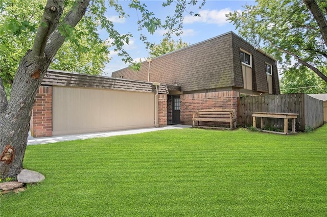 3729 Brush Creek Dr N, Lawrence, KS 66047 - view of front of house with brick siding, roof with shingles, and mansard roof