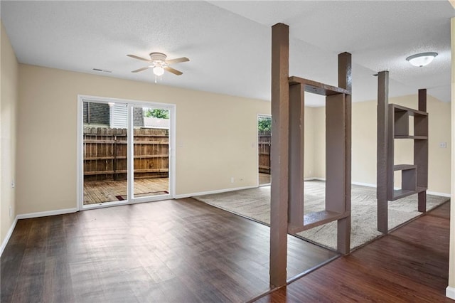 3729 Brush Creek Dr N, Lawrence, KS 66047 - empty room featuring wood finished floors, a ceiling fan, baseboards, and a textured ceiling