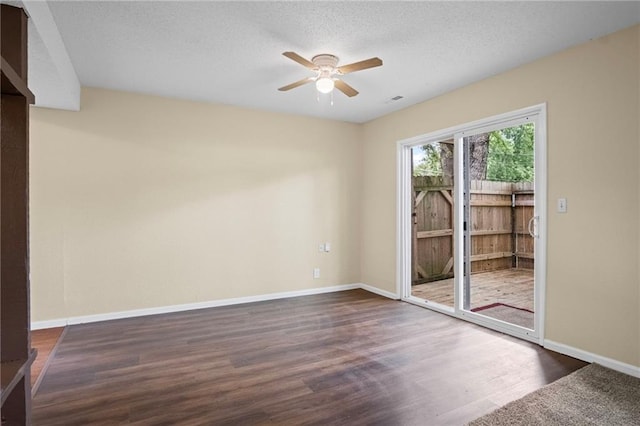 3729 Brush Creek Dr N, Lawrence, KS 66047 - unfurnished room featuring a ceiling fan, dark wood-style floors, baseboards, and a textured ceiling
