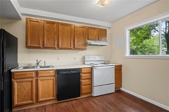3729 Brush Creek Dr N, Lawrence, KS 66047 - kitchen featuring black appliances, under cabinet range hood, dark wood-style floors, light countertops, and a sink