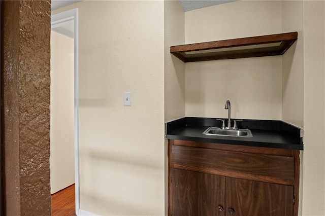 3729 Brush Creek Dr N, Lawrence, KS 66047 - indoor wet bar featuring wood finished floors