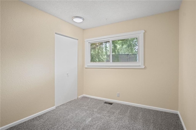 3729 Brush Creek Dr N, Lawrence, KS 66047 - empty room with carpet floors, baseboards, and a textured ceiling