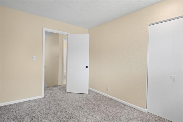 3729 Brush Creek Dr N, Lawrence, KS 66047 - unfurnished bedroom featuring carpet, a closet, and baseboards