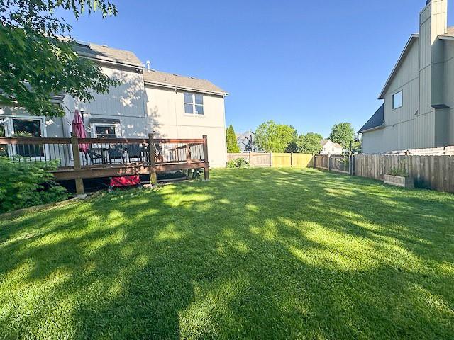 1101 SW Sunflower Dr, Lees Summit, MO 64081 - view of yard featuring a deck