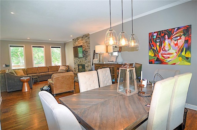 1101 SW Sunflower Dr, Lees Summit, MO 64081 - dining area featuring crown molding, wood finished floors, recessed lighting, baseboards, and a fireplace