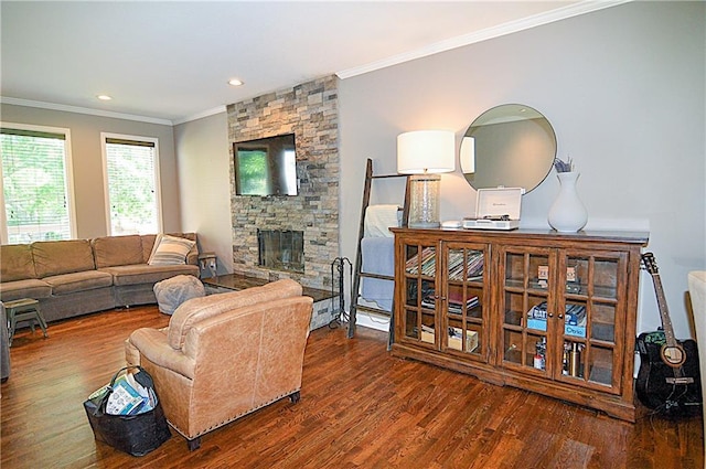 1101 SW Sunflower Dr, Lees Summit, MO 64081 - living area with wood finished floors, crown molding, a stone fireplace, and recessed lighting