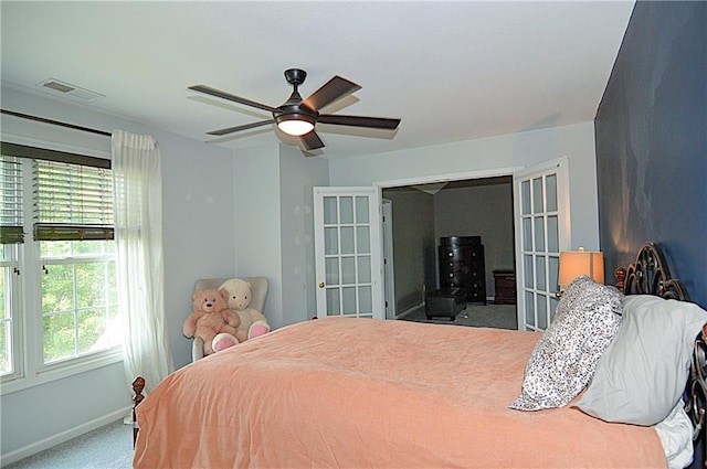1101 SW Sunflower Dr, Lees Summit, MO 64081 - bedroom with french doors, carpet flooring, baseboards, and ceiling fan