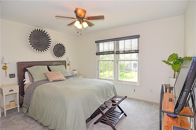 1101 SW Sunflower Dr, Lees Summit, MO 64081 - bedroom with light colored carpet, baseboards, and a ceiling fan