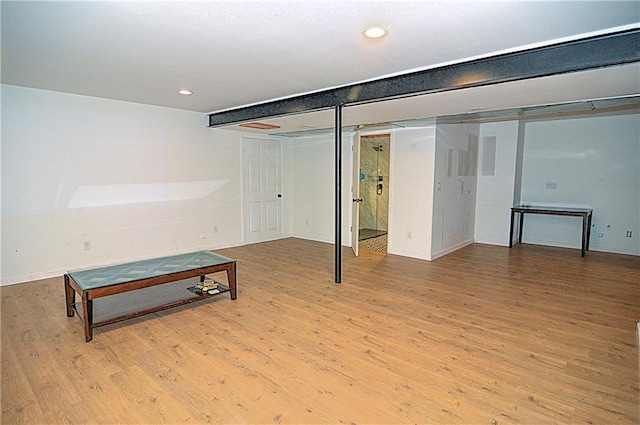 1101 SW Sunflower Dr, Lees Summit, MO 64081 - finished basement featuring wood finished floors, baseboards, and recessed lighting