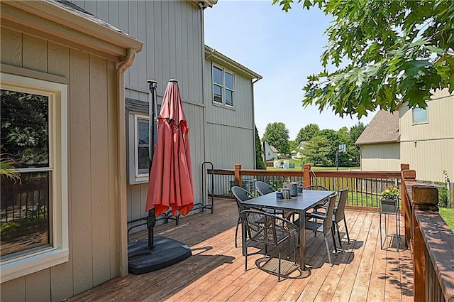 1101 SW Sunflower Dr, Lees Summit, MO 64081 - wooden deck with outdoor dining area