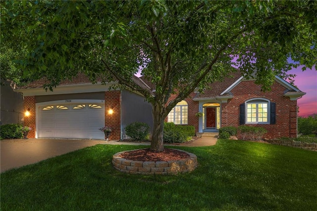 7904 W 153rd Ter, Overland Park, KS 66223 - view of front facade with driveway, a yard, an attached garage, and brick siding