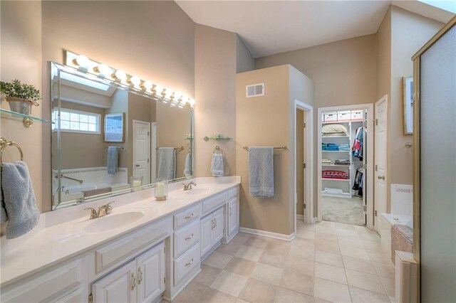 7904 W 153rd Ter, Overland Park, KS 66223 - full bath featuring double vanity, a bath, a spacious closet, and tile patterned flooring