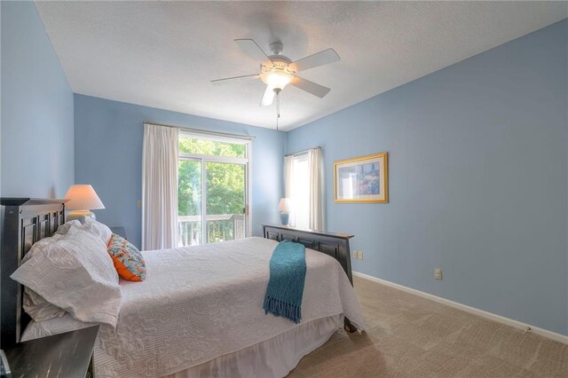 7904 W 153rd Ter, Overland Park, KS 66223 - carpeted bedroom with ceiling fan and access to exterior