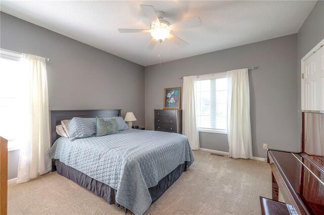 7904 W 153rd Ter, Overland Park, KS 66223 - bedroom with light carpet and a ceiling fan