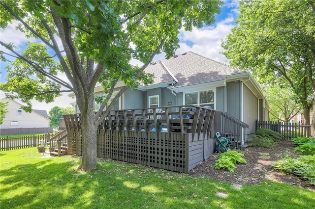 7904 W 153rd Ter, Overland Park, KS 66223 - back of house with stairs, a deck, a fenced backyard, and roof with shingles