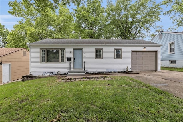 618 W Charles Ct, Independence, MO 64055 - view of front of home with driveway, a garage, and a front yard
