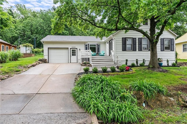 44 G St, Lake Lotawana, MO 64086 - ranch-style house with a garage, concrete driveway, and a front lawn