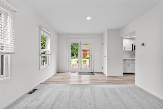 44 G St, Lake Lotawana, MO 64086 - entryway featuring light carpet, baseboards, and recessed lighting