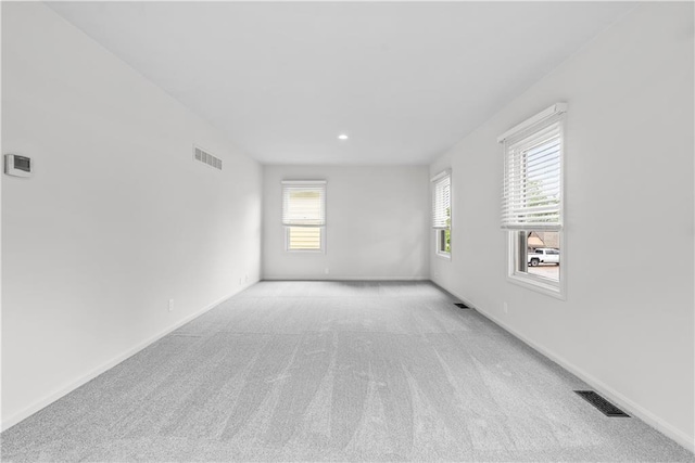 44 G St, Lake Lotawana, MO 64086 - empty room with light carpet, baseboards, and recessed lighting