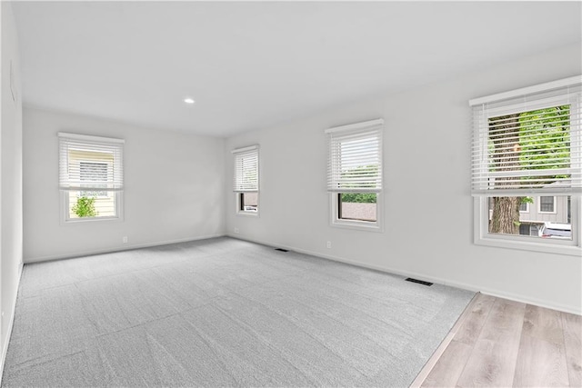 44 G St, Lake Lotawana, MO 64086 - unfurnished room featuring baseboards, wood finished floors, and recessed lighting