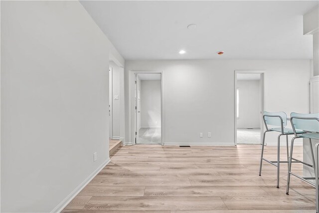 44 G St, Lake Lotawana, MO 64086 - empty room with light wood finished floors, recessed lighting, and baseboards