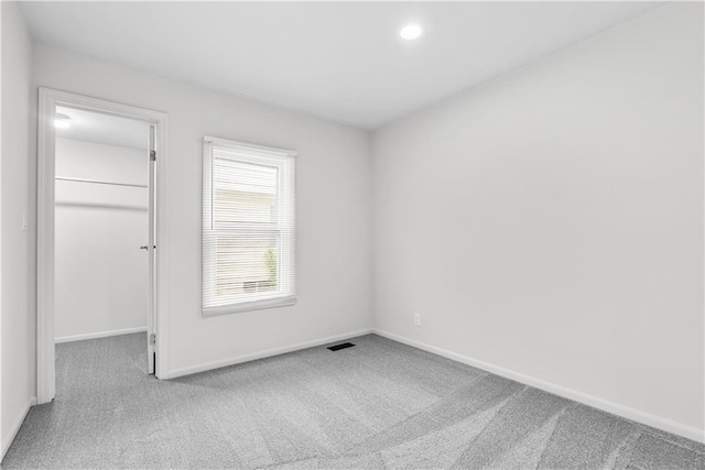44 G St, Lake Lotawana, MO 64086 - unfurnished bedroom featuring carpet, baseboards, a spacious closet, recessed lighting, and a closet