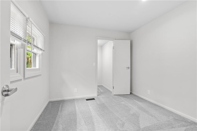 44 G St, Lake Lotawana, MO 64086 - spare room with carpet flooring and baseboards
