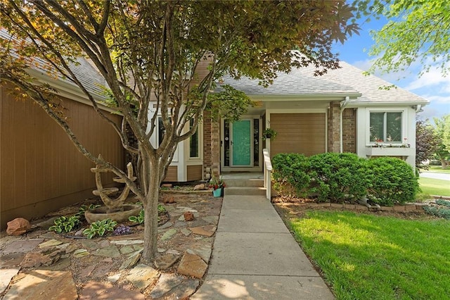 2432 SE 6th St, Lees Summit, MO 64063 - doorway to property with roof with shingles and brick siding