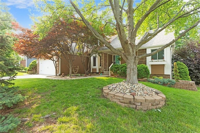 2432 SE 6th St, Lees Summit, MO 64063 - view of front facade featuring a front lawn, driveway, a garage, and brick siding