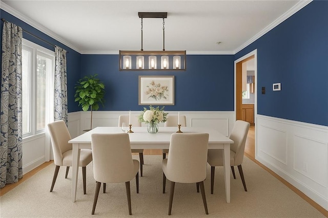 2432 SE 6th St, Lees Summit, MO 64063 - dining space with healthy amount of natural light, wainscoting, ornamental molding, and light wood-type flooring