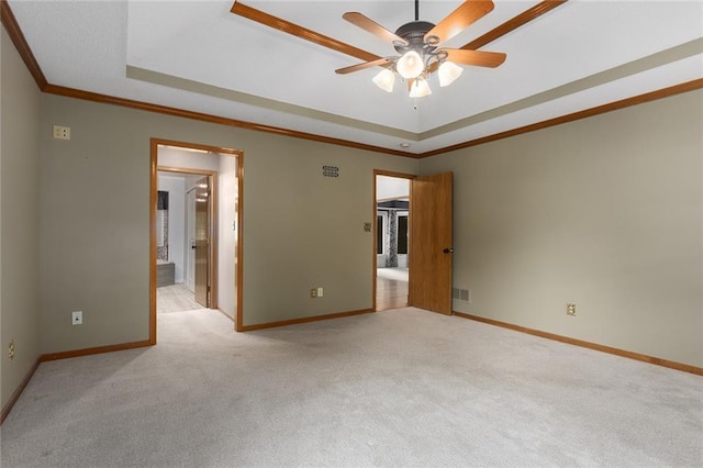 2432 SE 6th St, Lees Summit, MO 64063 - unfurnished bedroom with a raised ceiling, carpet flooring, crown molding, and ensuite bathroom