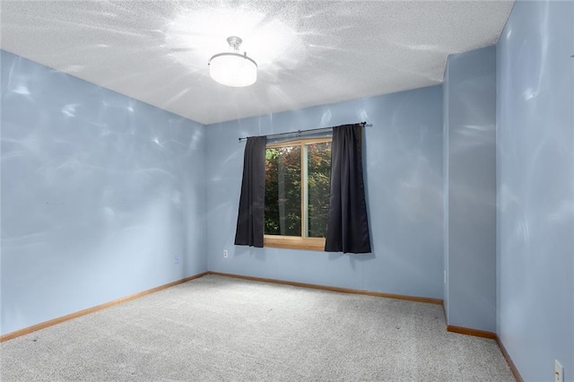 2432 SE 6th St, Lees Summit, MO 64063 - unfurnished room with carpet flooring and a textured ceiling