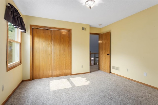 2432 SE 6th St, Lees Summit, MO 64063 - unfurnished bedroom featuring carpet and a closet