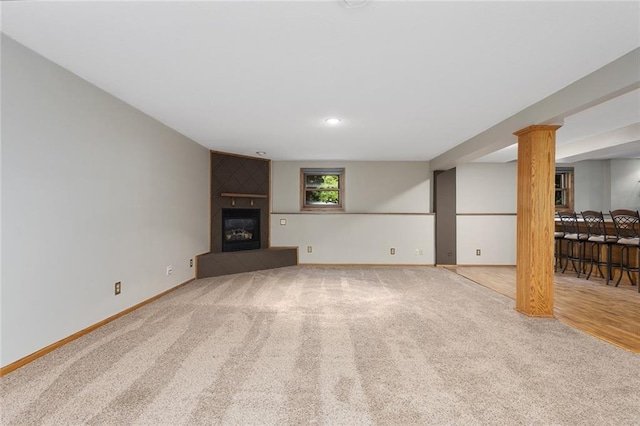 2432 SE 6th St, Lees Summit, MO 64063 - unfurnished living room with carpet flooring, a fireplace, and recessed lighting