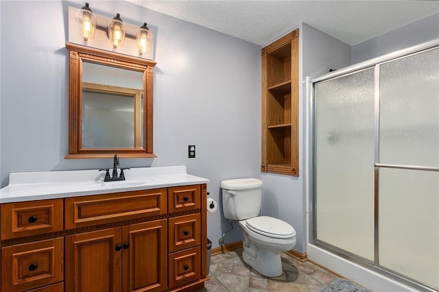 2432 SE 6th St, Lees Summit, MO 64063 - full bathroom featuring vanity, a shower stall, and a textured ceiling