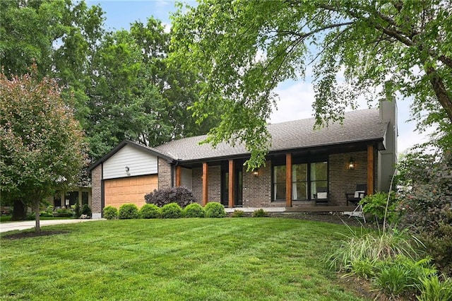 110 Cherokee Ln, Lake Winnebago, MO 64034 - view of front of property featuring an attached garage, brick siding, a front lawn, a chimney, and driveway