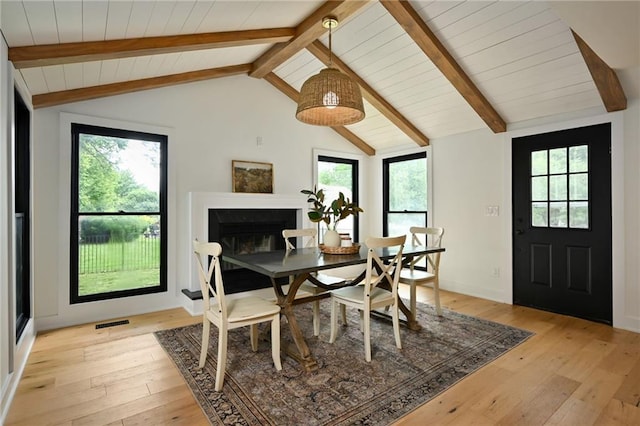 110 Cherokee Ln, Lake Winnebago, MO 64034 - dining room featuring light wood finished floors, a glass covered fireplace, and wooden ceiling