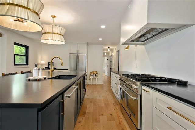 110 Cherokee Ln, Lake Winnebago, MO 64034 - kitchen featuring premium appliances, dark countertops, premium range hood, a sink, and recessed lighting