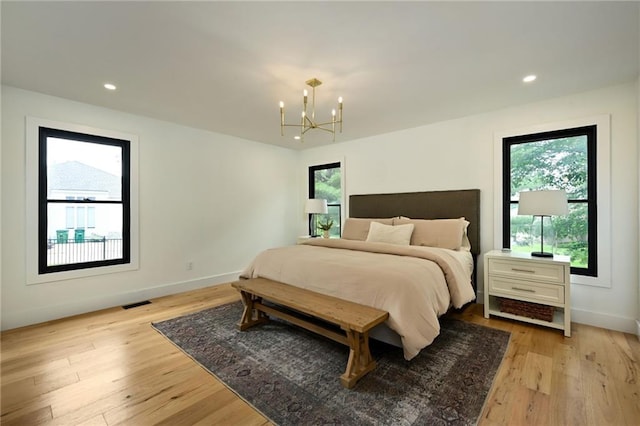 110 Cherokee Ln, Lake Winnebago, MO 64034 - bedroom featuring a chandelier, light wood-style floors, baseboards, and recessed lighting