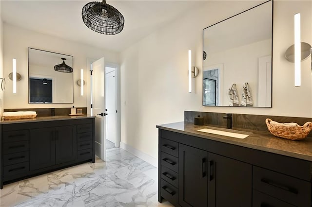 110 Cherokee Ln, Lake Winnebago, MO 64034 - full bath featuring marble look tile flooring, two vanities, and baseboards