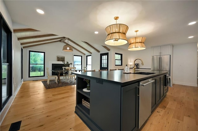 110 Cherokee Ln, Lake Winnebago, MO 64034 - kitchen featuring a sink, dark countertops, light wood-style flooring, baseboards, and open shelves