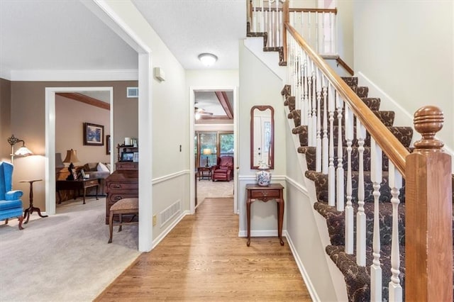 12806 Goddard Ave, Overland Park, KS 66213 - entryway with stairs, light wood-style floors, ornamental molding, and baseboards