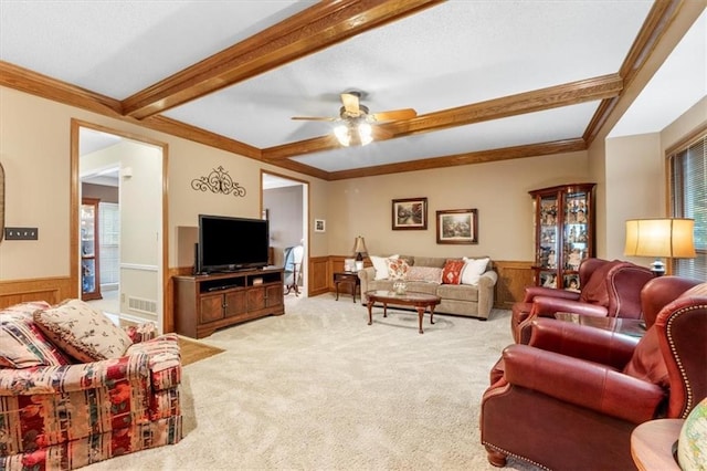 12806 Goddard Ave, Overland Park, KS 66213 - carpeted living area featuring a wainscoted wall, crown molding, a ceiling fan, and beamed ceiling