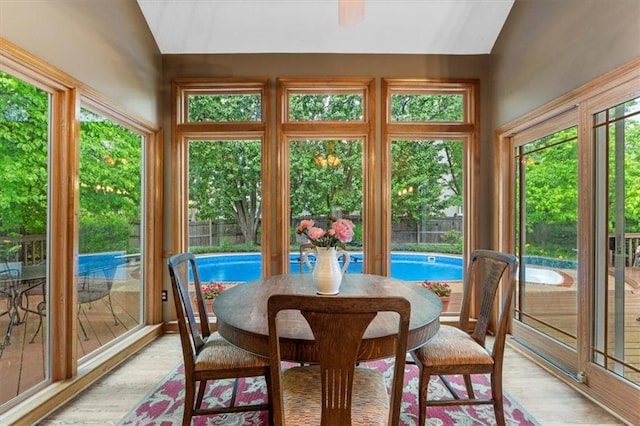 12806 Goddard Ave, Overland Park, KS 66213 - sunroom with lofted ceiling, healthy amount of natural light, and wood finished floors