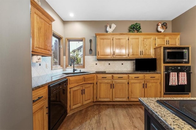 12806 Goddard Ave, Overland Park, KS 66213 - kitchen featuring black appliances, a sink, dark wood-type flooring, decorative backsplash, and recessed lighting