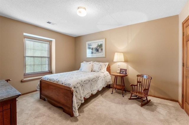 12806 Goddard Ave, Overland Park, KS 66213 - bedroom featuring light carpet, baseboards, and a textured ceiling