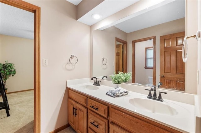 12806 Goddard Ave, Overland Park, KS 66213 - full bath featuring toilet, double vanity, and baseboards